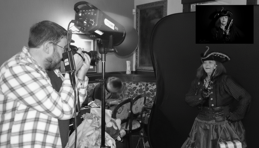 Pirate-Themed Portrait Session - Behind the Scenes with Carl Cooper Carl Cooper capturing a woman in pirate costume during a themed studio shoot with dramatic lighting